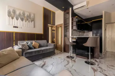 a living room with a couch and a piano at Angie's Dream Home - Spanish Steps Rome in Rome