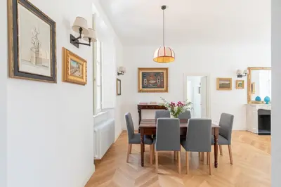 a dining room with a table and chairs at iFlat Campo de' Fiori Brand New & Bright apt in Rome