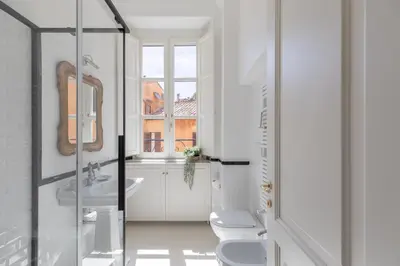 a bathroom with a toilet and a sink at iFlat Campo de' Fiori Brand New & Bright apt in Rome
