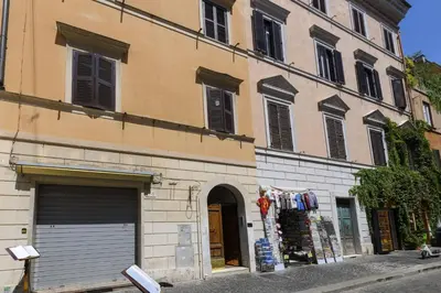 a building with two garage doors on a street at Bernini al Borgo in Rome