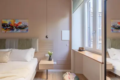 a bedroom with a bed and a window at iFlat Saint Peter Green Chic Brand New Apartment in Rome