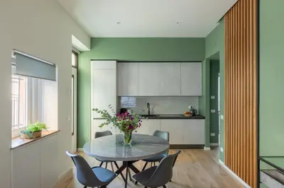 a dining room with a table and chairs at iFlat Saint Peter Green Chic Brand New Apartment in Rome