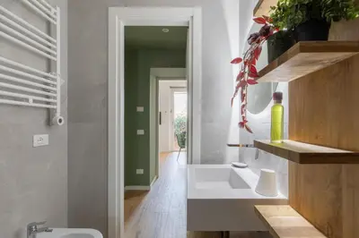 a bathroom with a white sink and a mirror at iFlat Saint Peter Green Chic Brand New Apartment in Rome