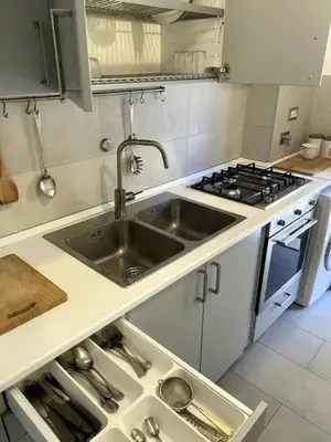 a kitchen with a sink and a stove at Apartment Roma San Pietro in Rome