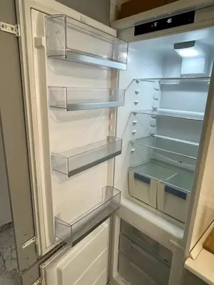 a refrigerator with its door open with its shelves at Apartment Roma San Pietro in Rome