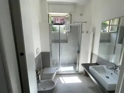 a bathroom with a shower and a toilet and a sink at Apartment Roma San Pietro in Rome