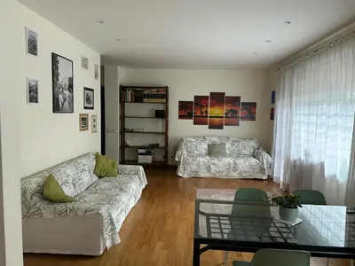 a living room with a couch and a bed at Rifugio Belsito in Rome