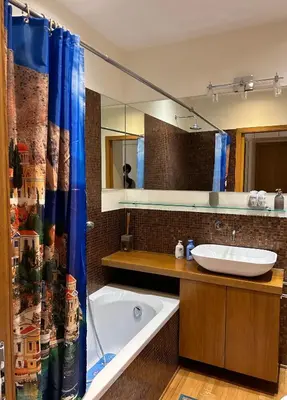 a bathroom with a tub and a sink and a mirror at Rifugio Belsito in Rome