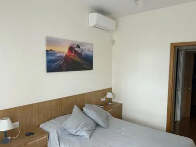 a bedroom with a bed and a picture on the wall at Rifugio Belsito in Rome