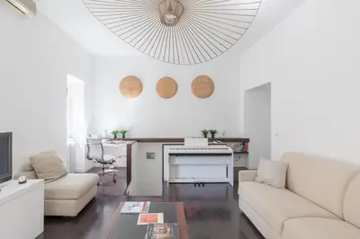 a living room with a couch and a table at iFlat Colosseum Modern & Peaceful Design Apt in Rome