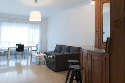 a living room with a couch and a table at House in the City in Rome