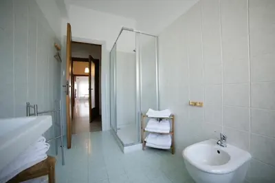 a bathroom with a shower and a sink and a toilet at House in the City in Rome