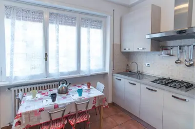 a kitchen with a table with a tea kettle on it at House in the City in Rome