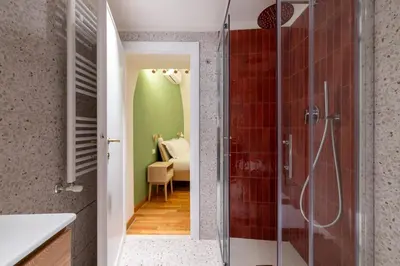 a bathroom with a shower and a bedroom at Charming 3 Bedroom Apartment in the Historic Center in Rome