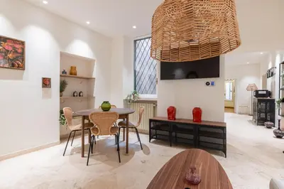a dining room with a table and chairs at Charming 3 Bedroom Apartment in the Historic Center in Rome