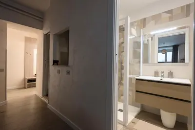 a bathroom with a sink and a mirror at 2passi dal Colosseo in Rome