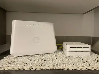 an apple computer and a printer sitting on a table at San Lorenzo Private Apartment in Rome