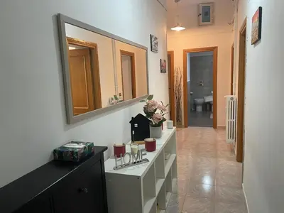a bathroom with a sink and a mirror at San Lorenzo Private Apartment in Rome