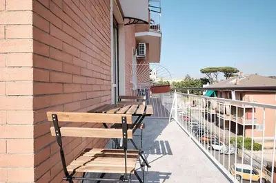 two benches on the side of a building at Ospedale Gemelli-Vaticano Domus Di Pace 1BDR by Hôtea in Rome