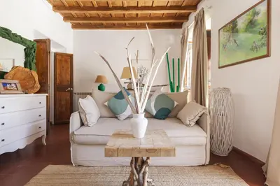 a living room with a couch and a table at Campo dei Fiori Luxury Gold in Rome
