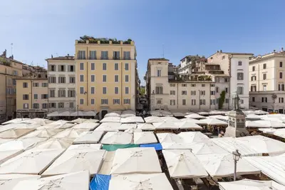a bunch of umbrellas in a city with buildings at Campo dei Fiori Luxury Gold in Rome