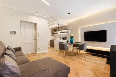 a living room with a couch and a table at Spanish Steps Modern Gem in Rome