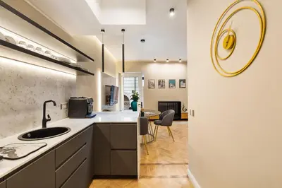 a kitchen with a sink and a counter at Spanish Steps Modern Gem in Rome