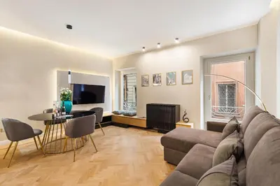a living room with a couch and a table at Spanish Steps Modern Gem in Rome