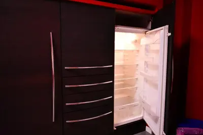 an empty refrigerator with its door open in a room at Domus DiDio in Rome