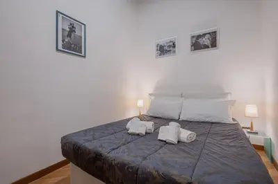 a bedroom with a bed with towels on it at Exclusive Campo dei Fiori Flat in Rome