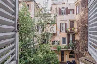 an alley between two old buildings in a city at Exclusive Campo dei Fiori Flat in Rome