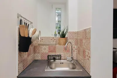 a kitchen counter with a sink in a kitchen at Colosseo Mon Amour in Rome
