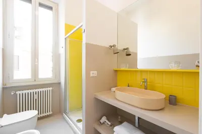 a bathroom with a sink and a toilet at La Stella Apartment by Hostand in Rome