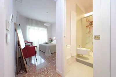 a room with a bathroom with a bed and a sink at On Rome Affittacamere o GuestHouse in Rome