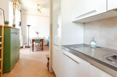 a kitchen with a sink and a counter top at Porta Maggiore Cozy Apartment in Rome