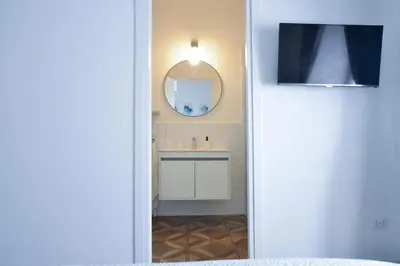 a bathroom with a sink and a mirror at Apartment 29 in Rome