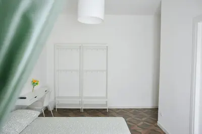 a white room with a desk and a window at Apartment 29 in Rome