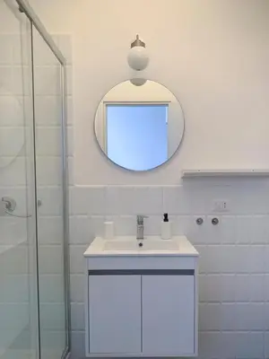 a bathroom with a sink and a mirror on the wall at Apartment 29 in Rome