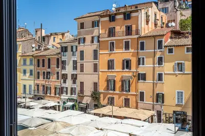 a view of a city with umbrellas and buildings at iFlat Campo dei Fiori View and SPA in Rome