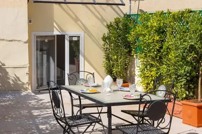 a table and chairs sitting on a patio at Amazing Domus Ruspoli in Rome