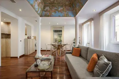 a living room with a couch and a table at Boschetto Boutique Apartment in Rome
