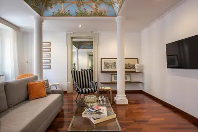 a living room with a couch and a table at Boschetto Boutique Apartment in Rome