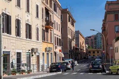 a street with cars parked on the side of the road at Castel Bolognese in Rome