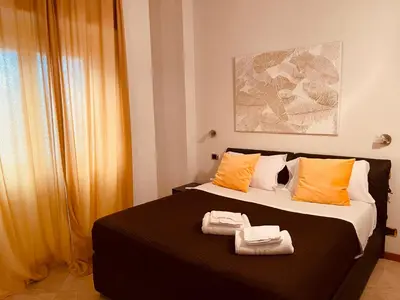 a bedroom with a bed with two towels on it at My Suite in Vatican - big terrace in Rome