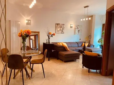 a living room with a couch and a table at My Suite in Vatican - big terrace in Rome