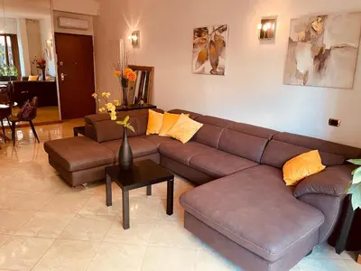 a living room with a brown couch and a table at My Suite in Vatican - big terrace in Rome