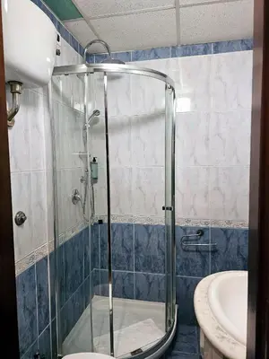 a bathroom with a shower with a toilet and a sink at Check in Rome in Rome