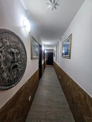 a hallway with a face on the wall at Check in Rome in Rome