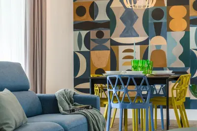 a living room with a blue couch and a table with chairs at PO1 Augusto - PO2 Cesare - PO3 Nerone in Rome