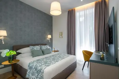 a hotel room with a bed and a window at PO1 Augusto - PO2 Cesare - PO3 Nerone in Rome